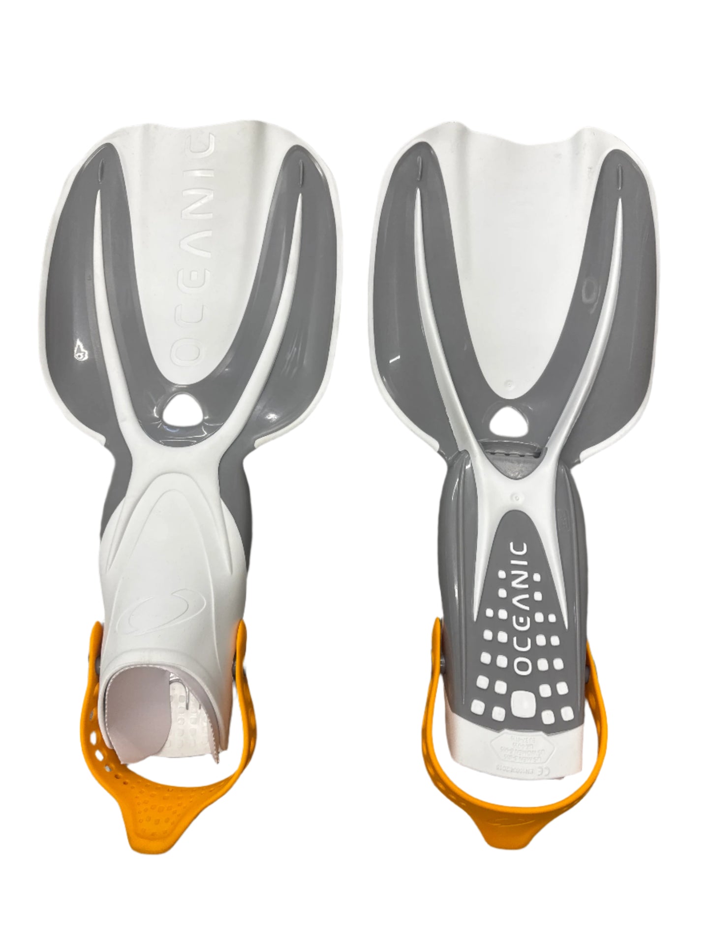 Pair of gray diving fins with orange tips on a dark background